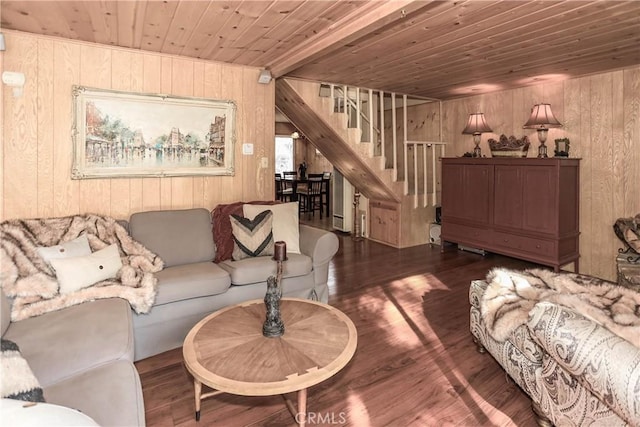 living room with wooden walls, wood ceiling, and dark hardwood / wood-style floors