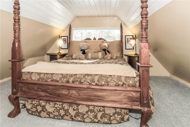 carpeted bedroom with wood ceiling and vaulted ceiling