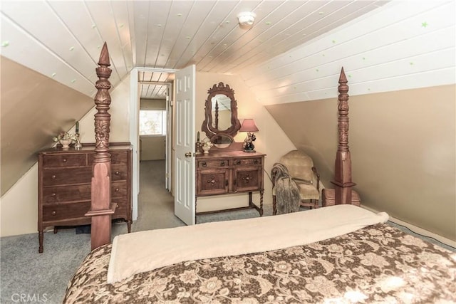 carpeted bedroom featuring vaulted ceiling and wooden ceiling