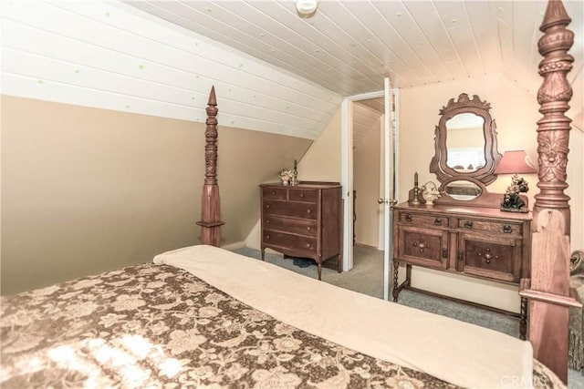 bedroom featuring carpet and lofted ceiling