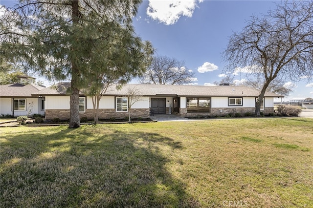 ranch-style home with a front lawn