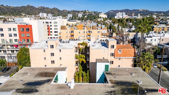 birds eye view of property featuring a mountain view