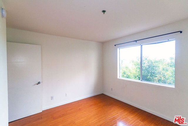 empty room with light hardwood / wood-style floors