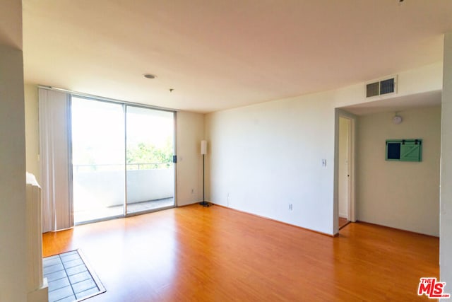 spare room with light wood-type flooring