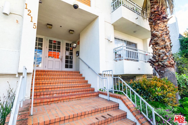 property entrance with a balcony