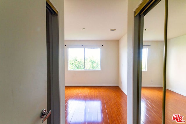 hall with light wood-type flooring