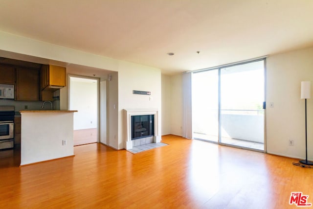 unfurnished living room featuring light hardwood / wood-style floors