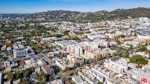 birds eye view of property featuring a mountain view