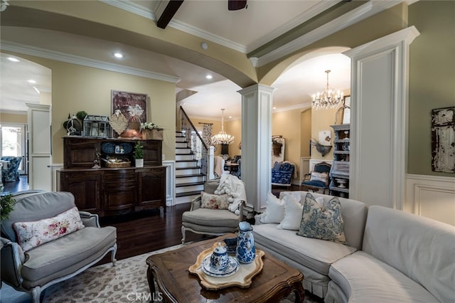 living room featuring ornamental molding, hardwood / wood-style floors, and decorative columns