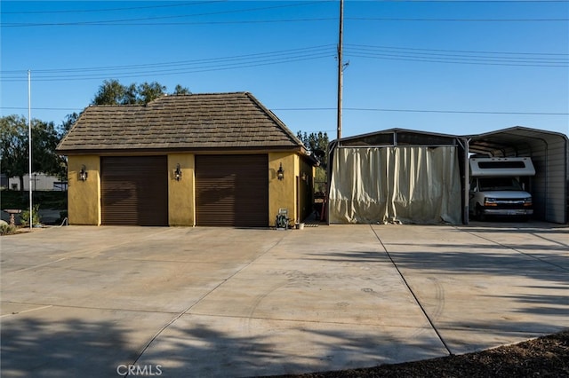 garage featuring a carport