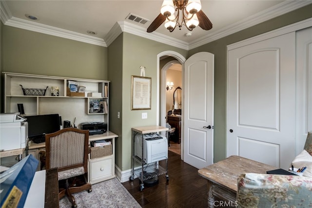 home office featuring dark hardwood / wood-style floors, ornamental molding, and ceiling fan