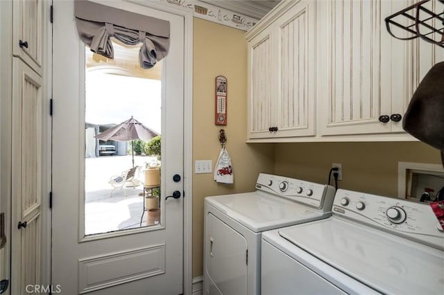 laundry room with cabinet space and washer and dryer