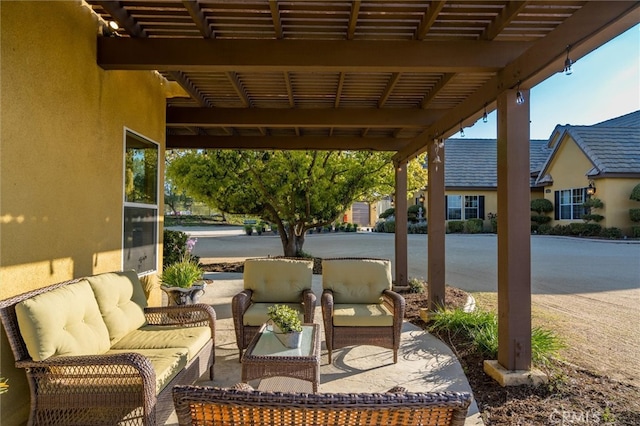 view of patio / terrace with outdoor lounge area and a pergola