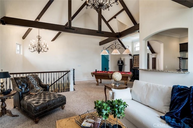carpeted living area with high vaulted ceiling, an inviting chandelier, billiards, and beam ceiling