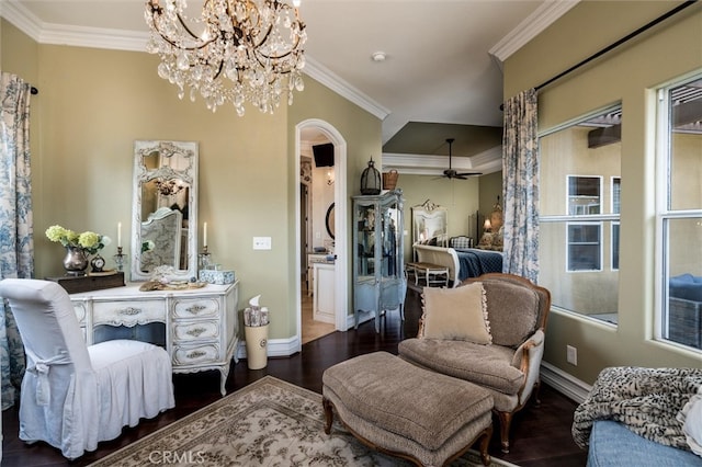 sitting room featuring ceiling fan with notable chandelier, dark hardwood / wood-style floors, and crown molding