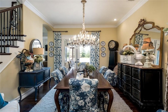 dining area with stairway, crown molding, a notable chandelier, and wood finished floors