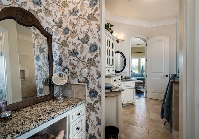 bathroom featuring ornamental molding, tile patterned flooring, and vanity