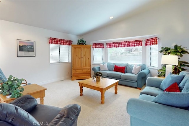 carpeted living room with vaulted ceiling