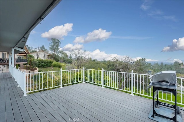 wooden terrace featuring grilling area