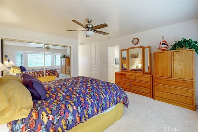 bedroom featuring ceiling fan, carpet, and a closet