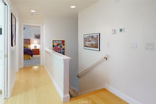 hall with hardwood / wood-style floors