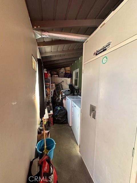 interior space featuring wooden ceiling and washing machine and clothes dryer