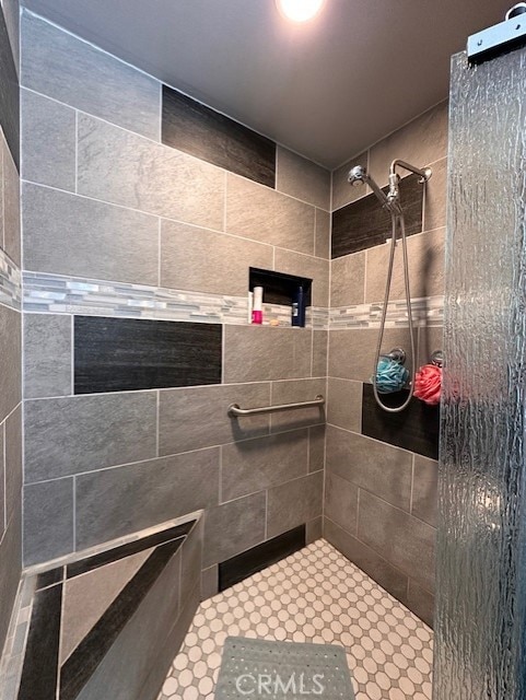 bathroom with a tile shower