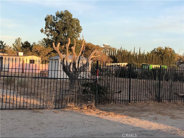 view of gate featuring fence