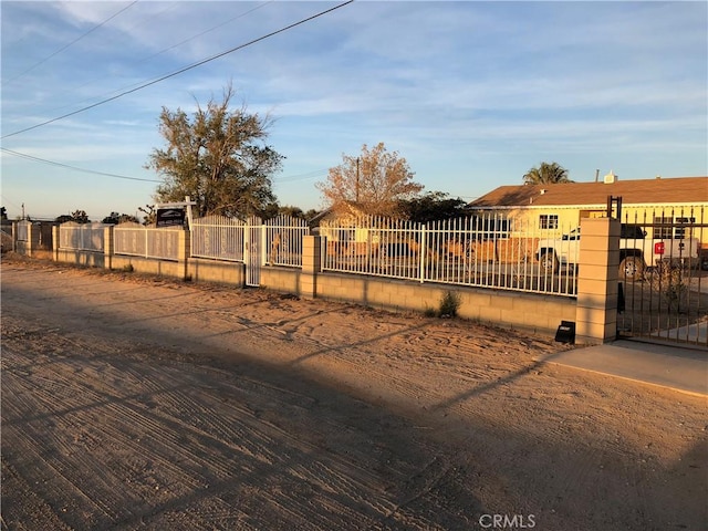 exterior space featuring a fenced front yard and a gate