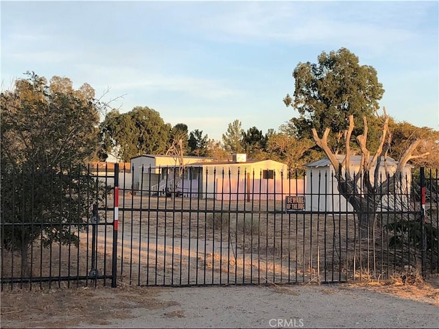 view of gate featuring fence