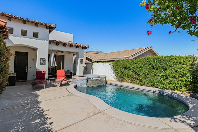 view of pool featuring an in ground hot tub and a patio area