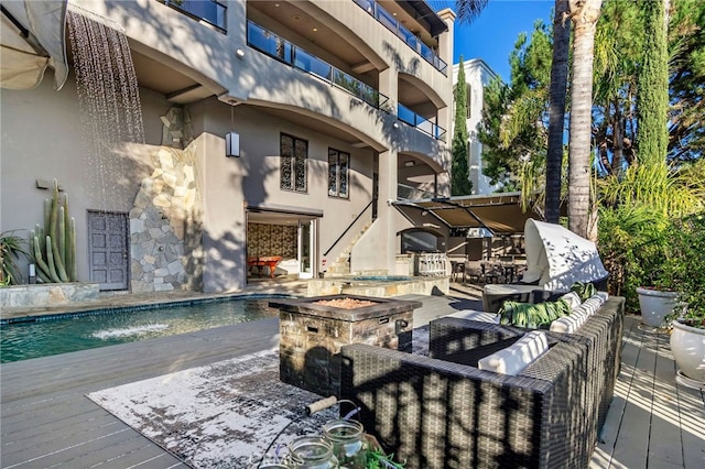 view of swimming pool featuring outdoor lounge area and pool water feature