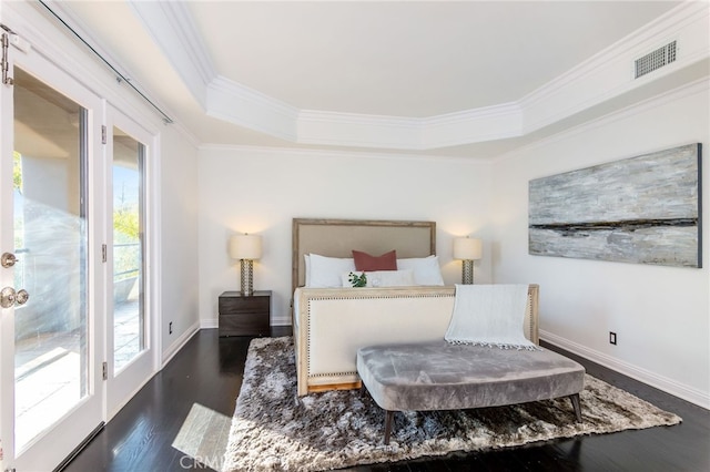 bedroom featuring multiple windows, ornamental molding, dark hardwood / wood-style floors, and access to exterior