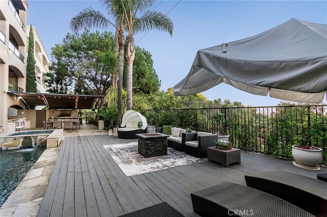 wooden deck featuring pool water feature, outdoor lounge area, and a pool with hot tub