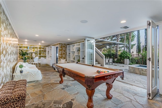 rec room featuring ornamental molding, pool table, and a wall of windows