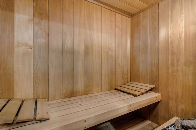 view of sauna / steam room with wood walls