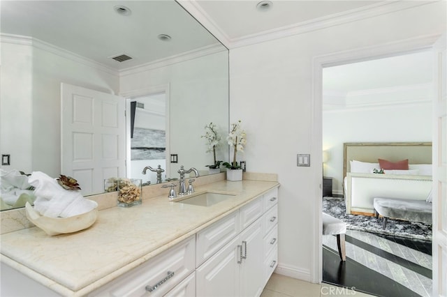 bathroom featuring ornamental molding, tile patterned floors, and vanity