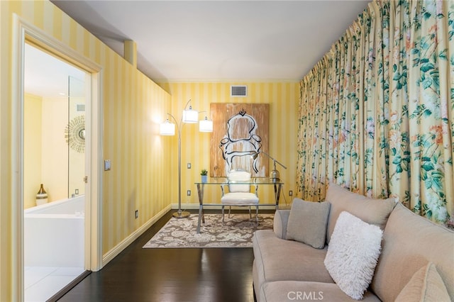 sitting room with dark hardwood / wood-style floors