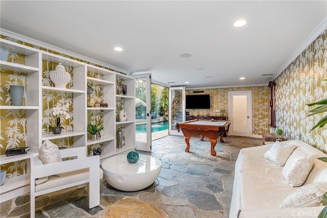 living room with crown molding and pool table