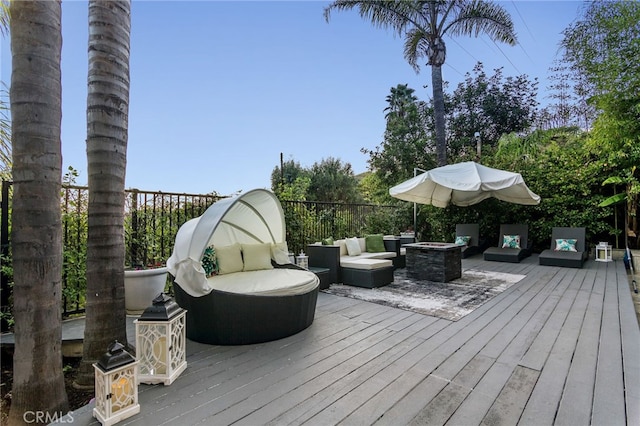 wooden deck with an outdoor living space