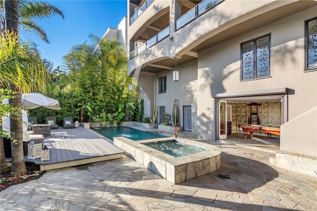 view of pool featuring an in ground hot tub and a patio area