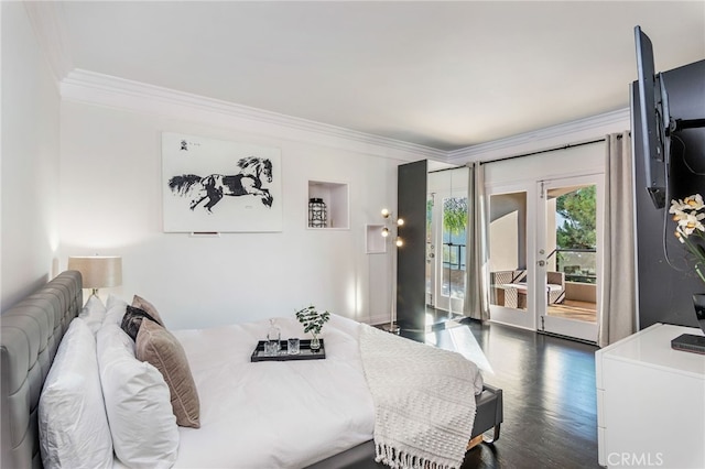 bedroom with ornamental molding, dark wood-type flooring, and access to outside