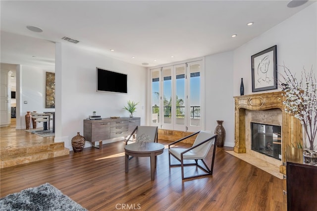 living room featuring a fireplace and dark hardwood / wood-style flooring