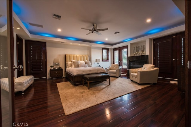 bedroom with ceiling fan and hardwood / wood-style flooring