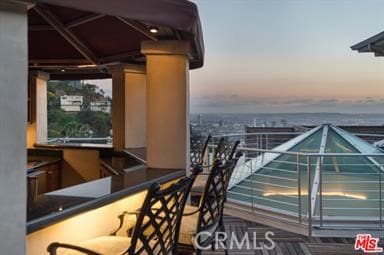 view of balcony at dusk