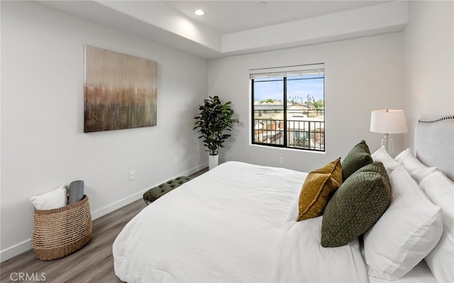 bedroom with hardwood / wood-style floors