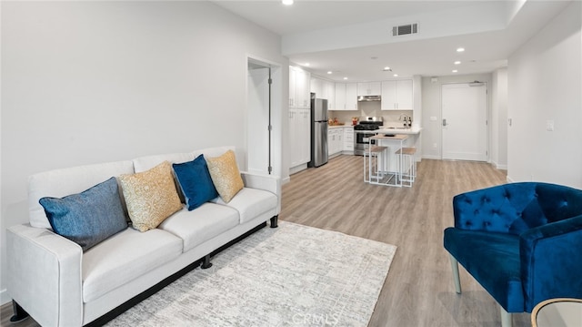 living room with light hardwood / wood-style floors