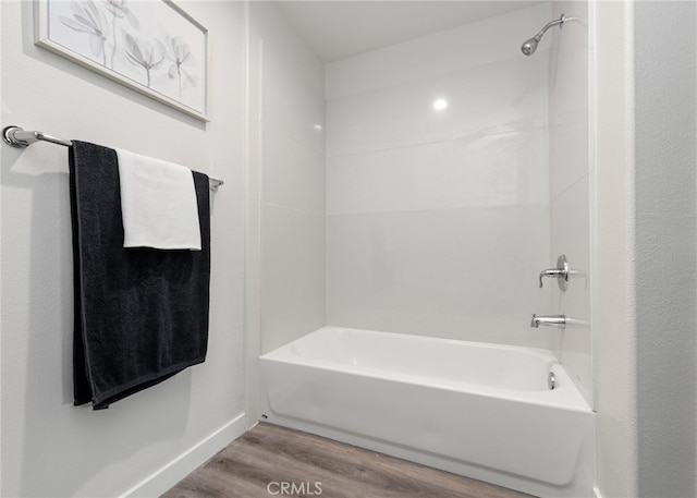 bathroom featuring hardwood / wood-style floors and shower / bathtub combination