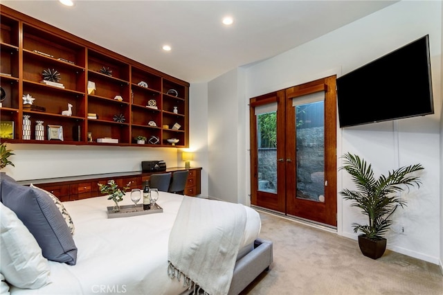 carpeted bedroom featuring access to exterior and french doors