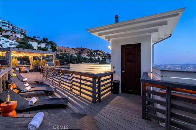 deck at dusk with a mountain view